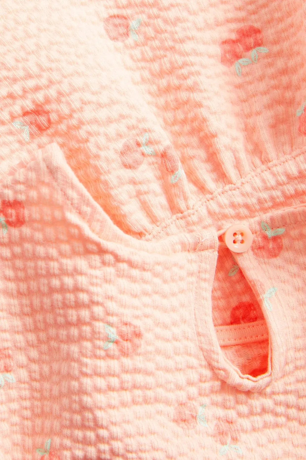 Persikkakuvioitu aaltoileva peplum-paita | Koralli | Lapset | Kappahl