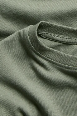 Puuvillatrikoota oleva pitkähihainen oversize-t-paita. | Vihreä | Lapset | Kappahl